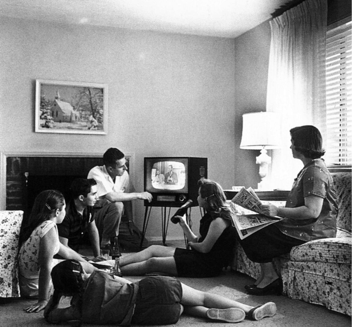 A family watching TV. Remember when that was a thing? No, me neither